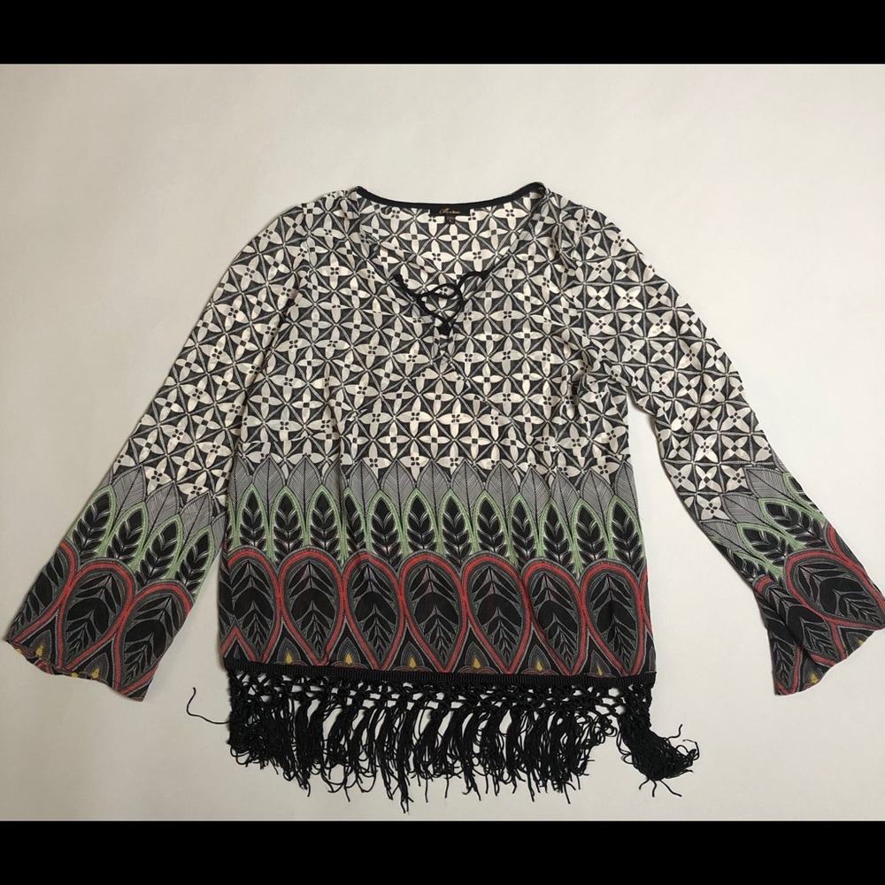 Sheer patterned tunic top with fringe detail